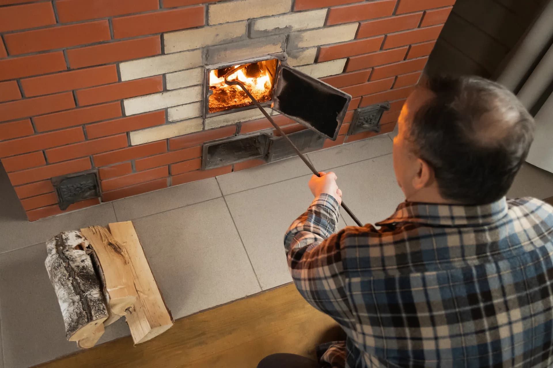 Warm fire in brick fireplace hearth